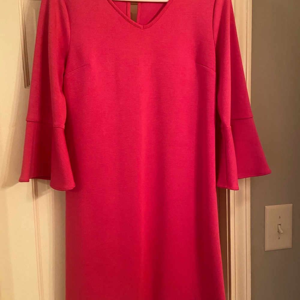 VERSONA pink bell sleeve dress. Falls above the knee.